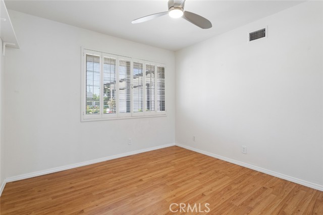 Bedroom 1 - with plantation shutters  and fan ceiling