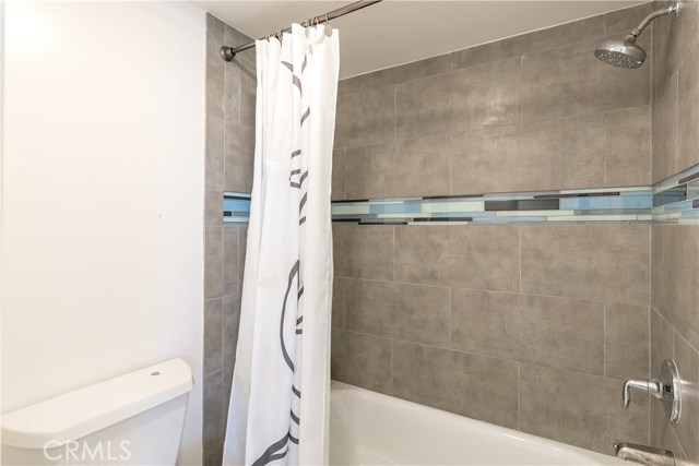 Lower level full bath (don't miss the hidden original built-in scale)!