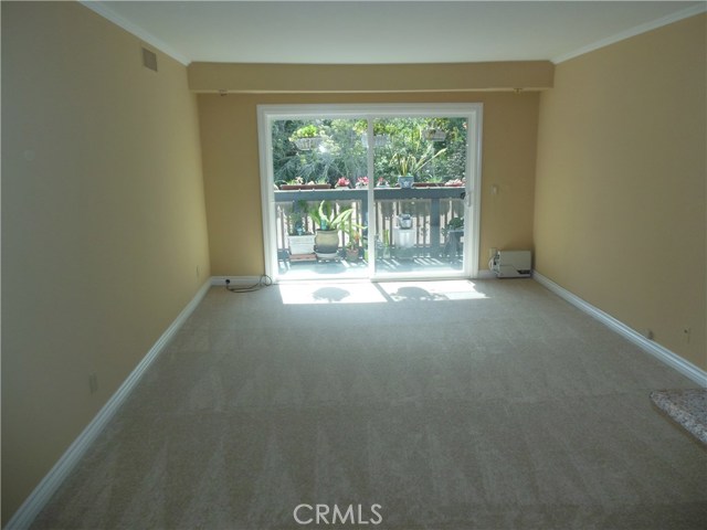 Living Room with Sliding Door to Private Balcony and Pastoral Views