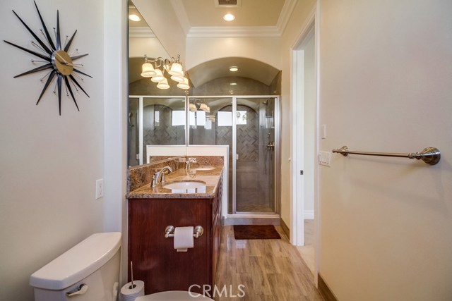 and oversized shower with bench make up the master bathroom.