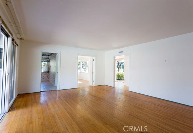 Living room from standing at fireplace.