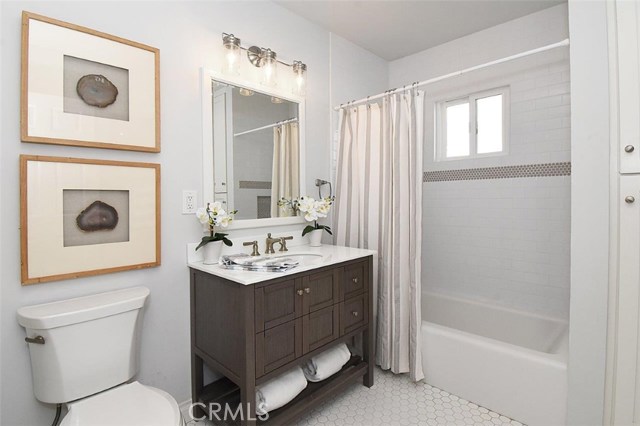 Hallway bathroom with linen closet or extra storage