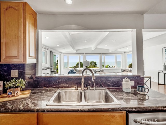 View from Kitchen Sink to Family Room and Ocean Views