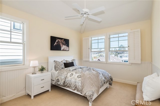 Spacious Bedrooms with Wain Scoting, Vaulted Ceilings, and Ceiling Fans