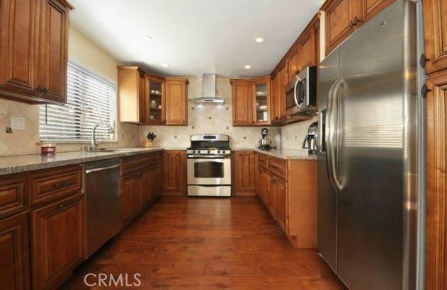 Beautiful kitchen with natural light, custom cabinetry and counters