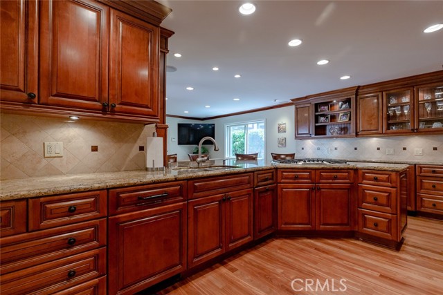 Large kitchen with large amount of custom cabinets