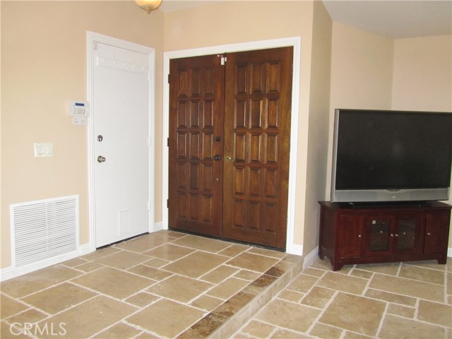 Double Doors Entrance and direct access White Door to Garage