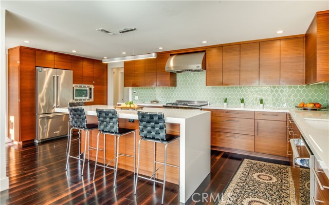 Masterfully designed Gourmet Kitchen with glass counter tops