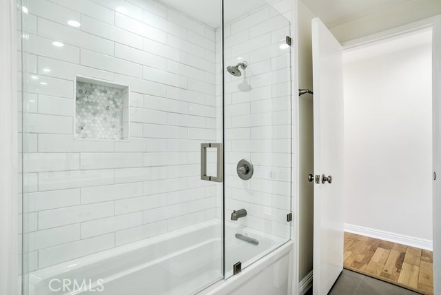 Shared full bath with double sinks.