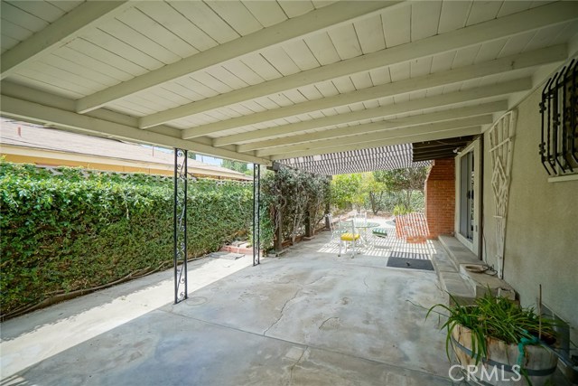 The shaded patio area off of the dining room extends all the way to the front RV parking area.