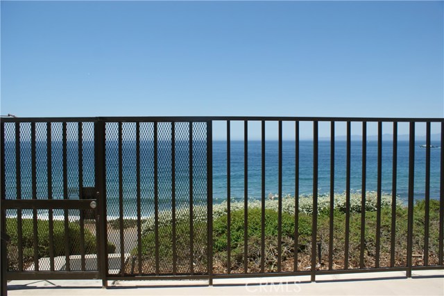 Beach access gate is located in the patio area