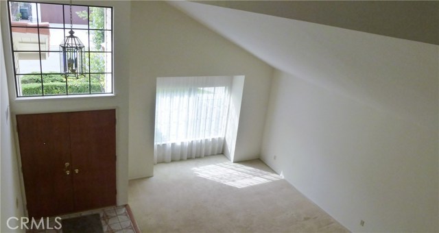 Looking down from 2nd floor to Entry/Living Room