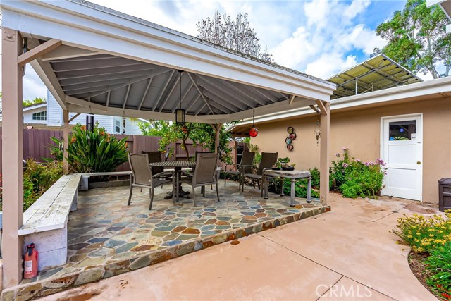 Great covered seating area off of pool.