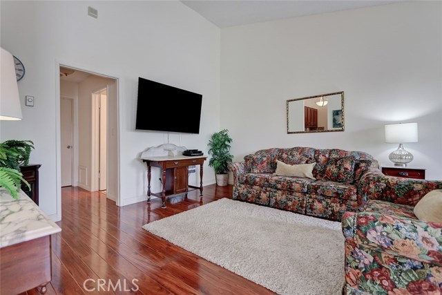 Living room with view of bedrooms and bathrooms down the hall.