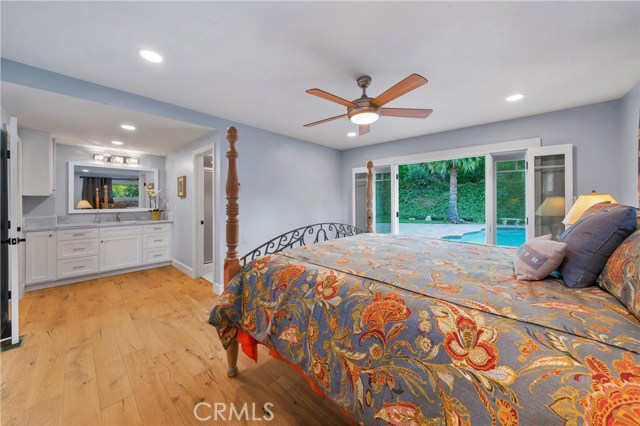 A peaceful and private master bedroom to relax and to enjoy the afternoon breeze through your French doors.