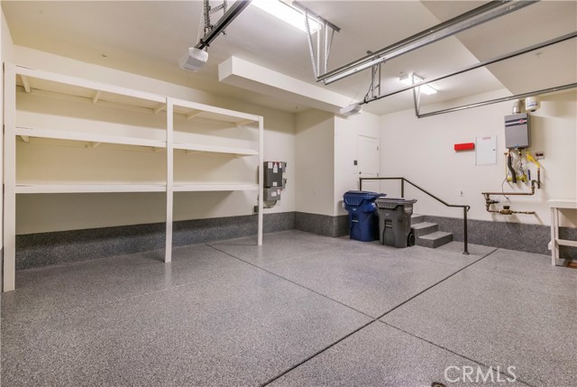 Oversized 2 car garage with Epoxy floor and built in storage shelves