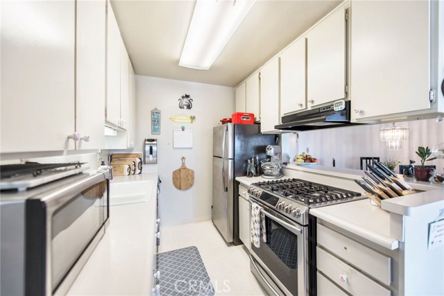 Kitchen with new Samsung, stainless steal stove, LG refrigerator and stainless steal microwave