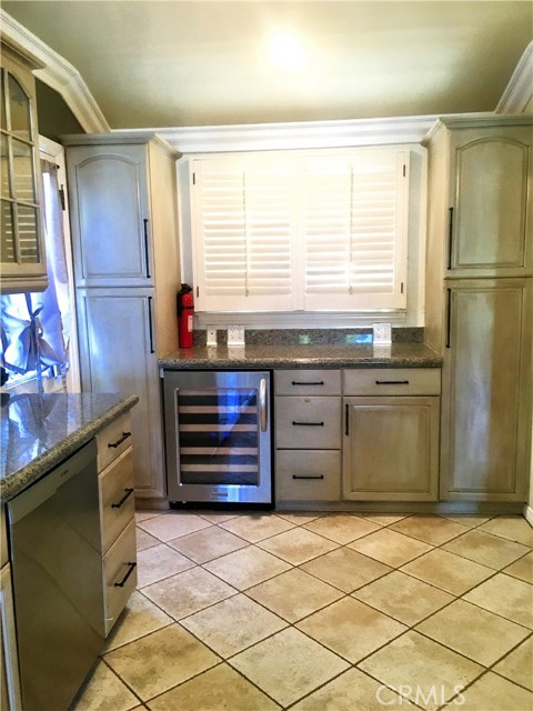 kitchen pantry space and built in wine refrigerator