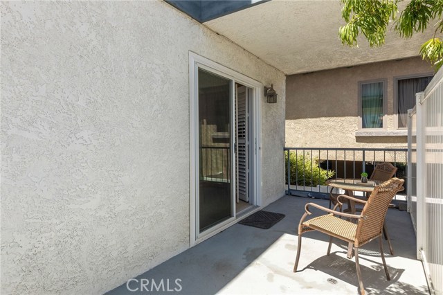Sliding door leads into Murphy bed suite. Sunny south/east exposure but cool shade in the afternoons on this deck.