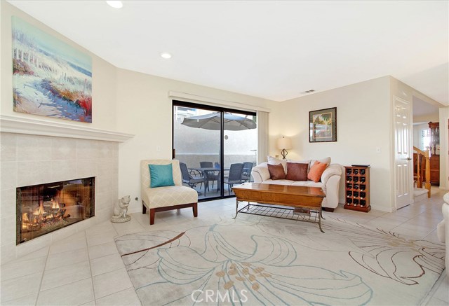 Family room with fireplace and sliders to private patio.