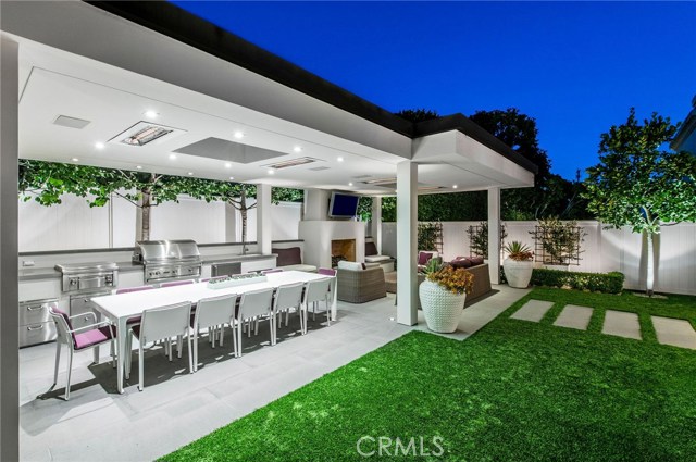 Outdoor Living Space with Chef's Kitchen, skylights, recessed lighting and heating, tv, and fireplace number 3.