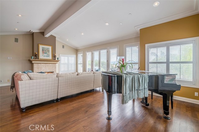 Formal living room with lots of windows and window shutters
