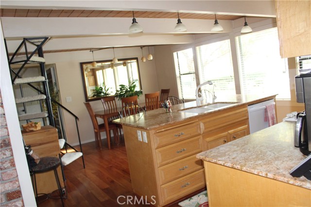 Kitchen from hallway the has Pantry, cleaning tools and washer dryer areas