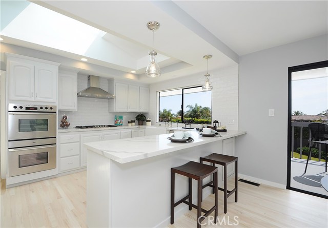 kitchen with Caesarstone counter tops and double ovens a