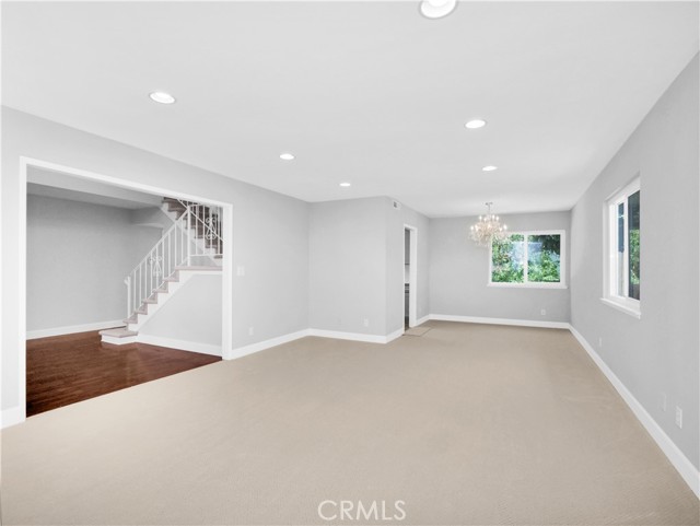 Great flow entry to living and dining room with sparkling chandelier Great flow entry to living and dining room with sparkling chandelier