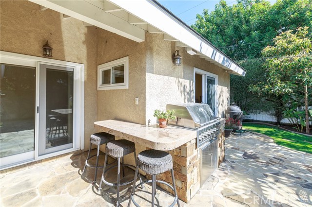 Built-In BBQ w/ Custom Wrap-Around Granite Countertop & Bar Seating, Sliding Patio Doors Built-In BBQ w/ Custom Wrap-Around Granite Countertop & Bar Seating, Sliding Patio Doors