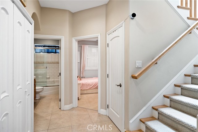 Enter the skylight filled staircase up to the main living level