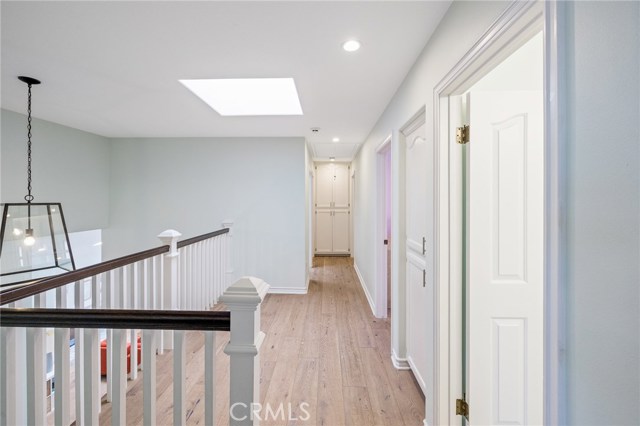 Sunlight filled landing at top of the stairs