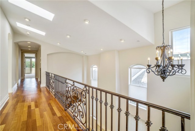 Brazilian cherry hallway and dramatic balcony