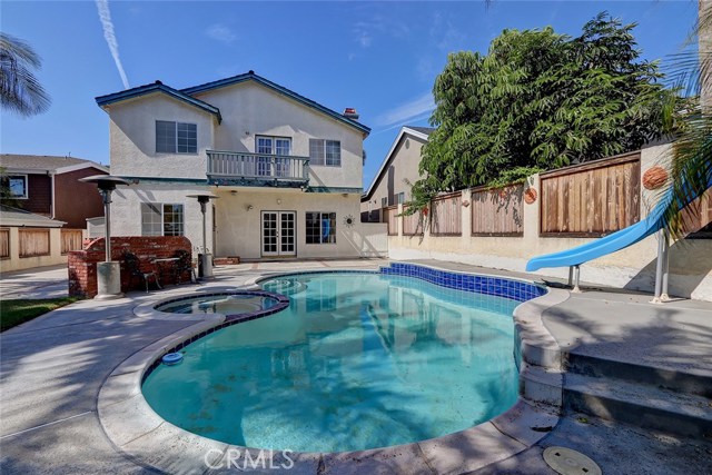 Backyard Patio and Pool Area with Adjacent Built-In BBQ