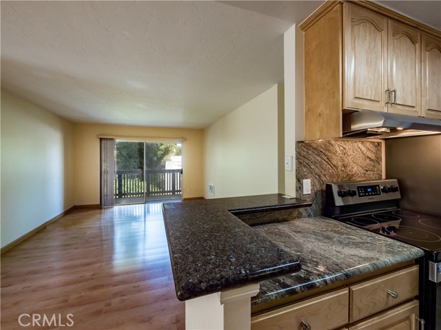 Remodeled kitchen includes maple cabinets, granite counters and all brand New Samsung stainless steel appliances including smooth top range, dishwasher, refrigerator, microwave.