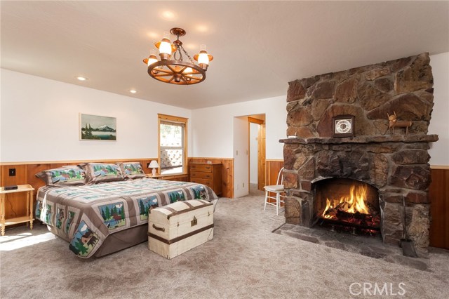 The large wood burning fireplace in the master suite.