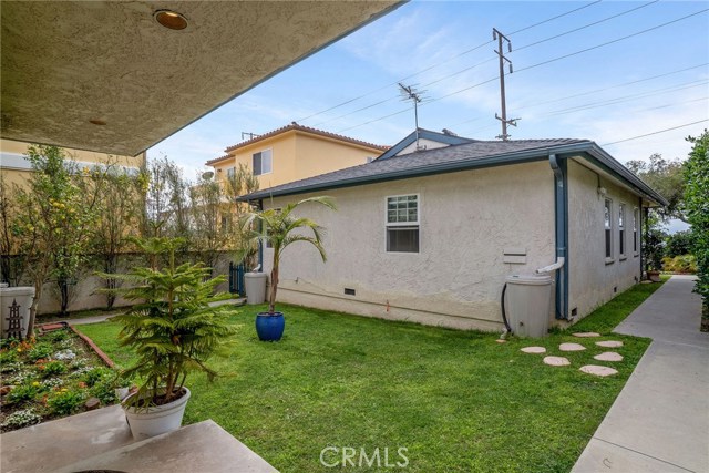 SPACIOUS YARD SEPARATING THE TWO HOMES.  VIEW FROM BACK HOUSE FRONT DOOR.