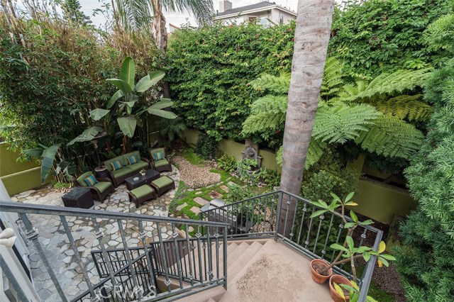 Stairs from formal dining room gives you easy access to your own private backyard