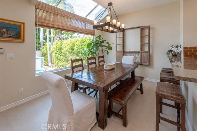 great window/skylight overlooking the pool and lush green private backyard