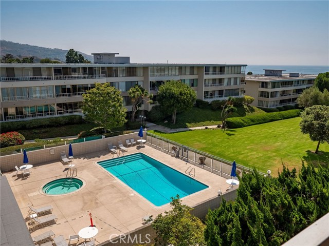 View of one of the pools (and spa) from living room window