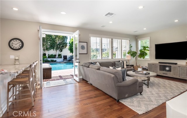 Family room opening to backyard with pool