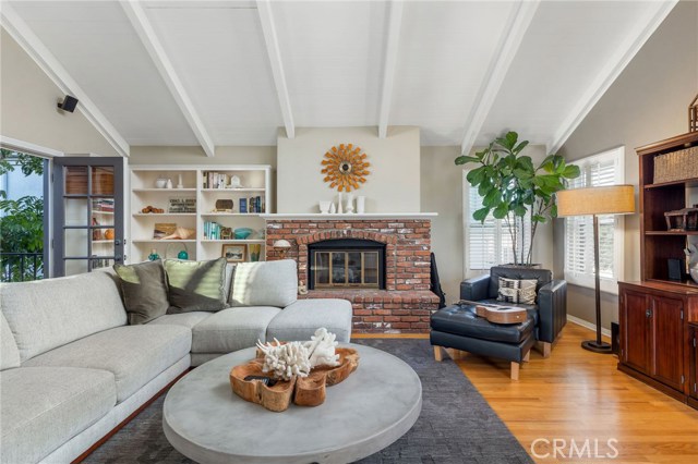 Large family room also features brick fireplace