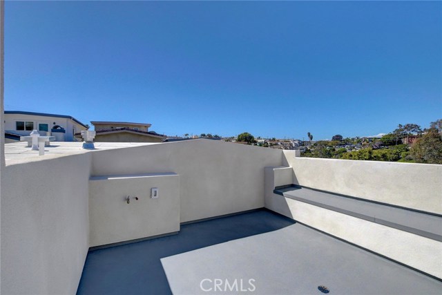 3rd Level . . .  Roof Top Deck with built in seating