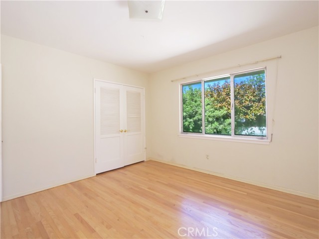 Second bedroom with beautiful hardwood floors.