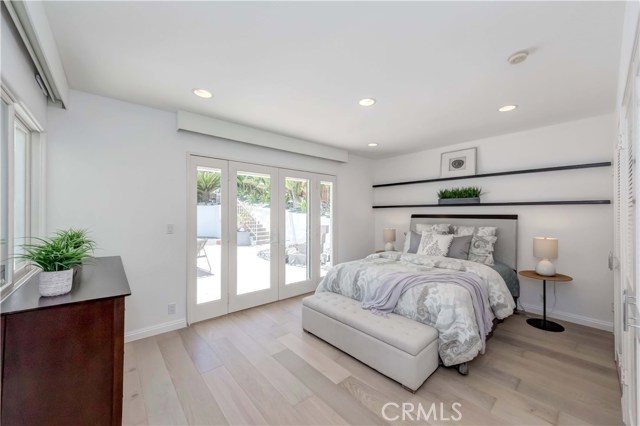Bedroom #2: French-door to backyard patio, recessed lighting, dual door closets