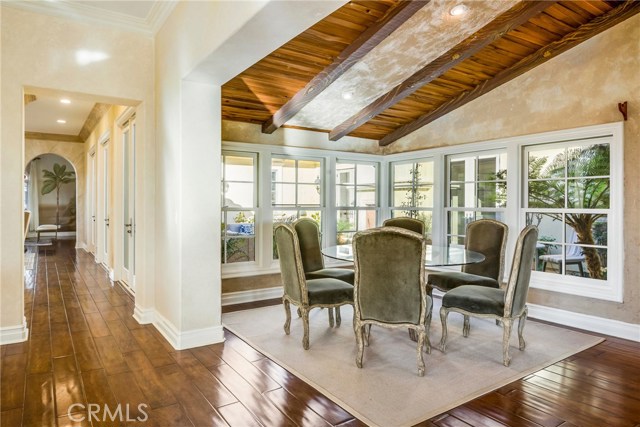 Breakfast nook looking out at the interior patio. Nice custom vaulted ceiling and open to the kitchen family room area.