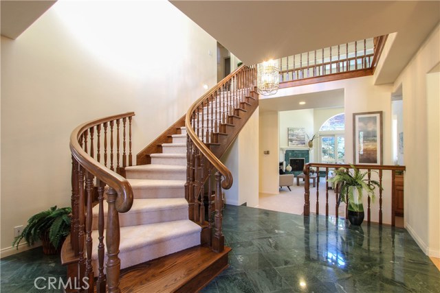 Dramatic Foyer with beautiful Marble flooring.