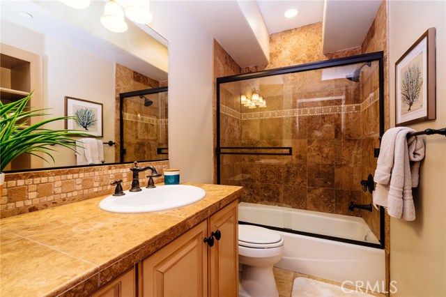 The full bathroom located downstairs with bedroom #2 and #3 features attractive finishes.