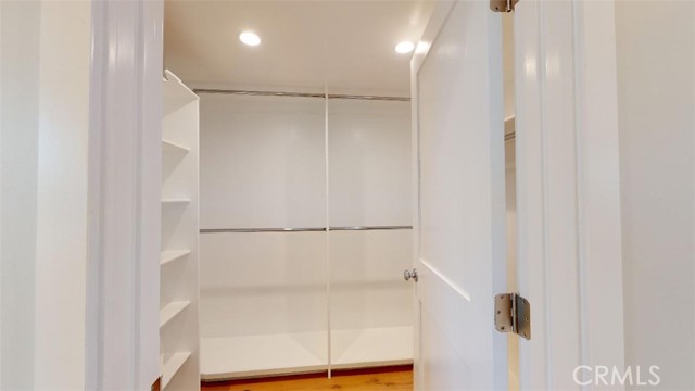 your own his and her dressing rooms and closets with built-in shelving. notice the elegant shaker style doors which are used throughout the whole house