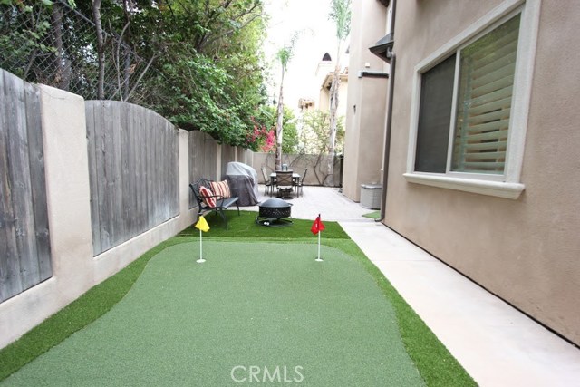Rear oasis hideaway from opposite perspective. The green calls you.